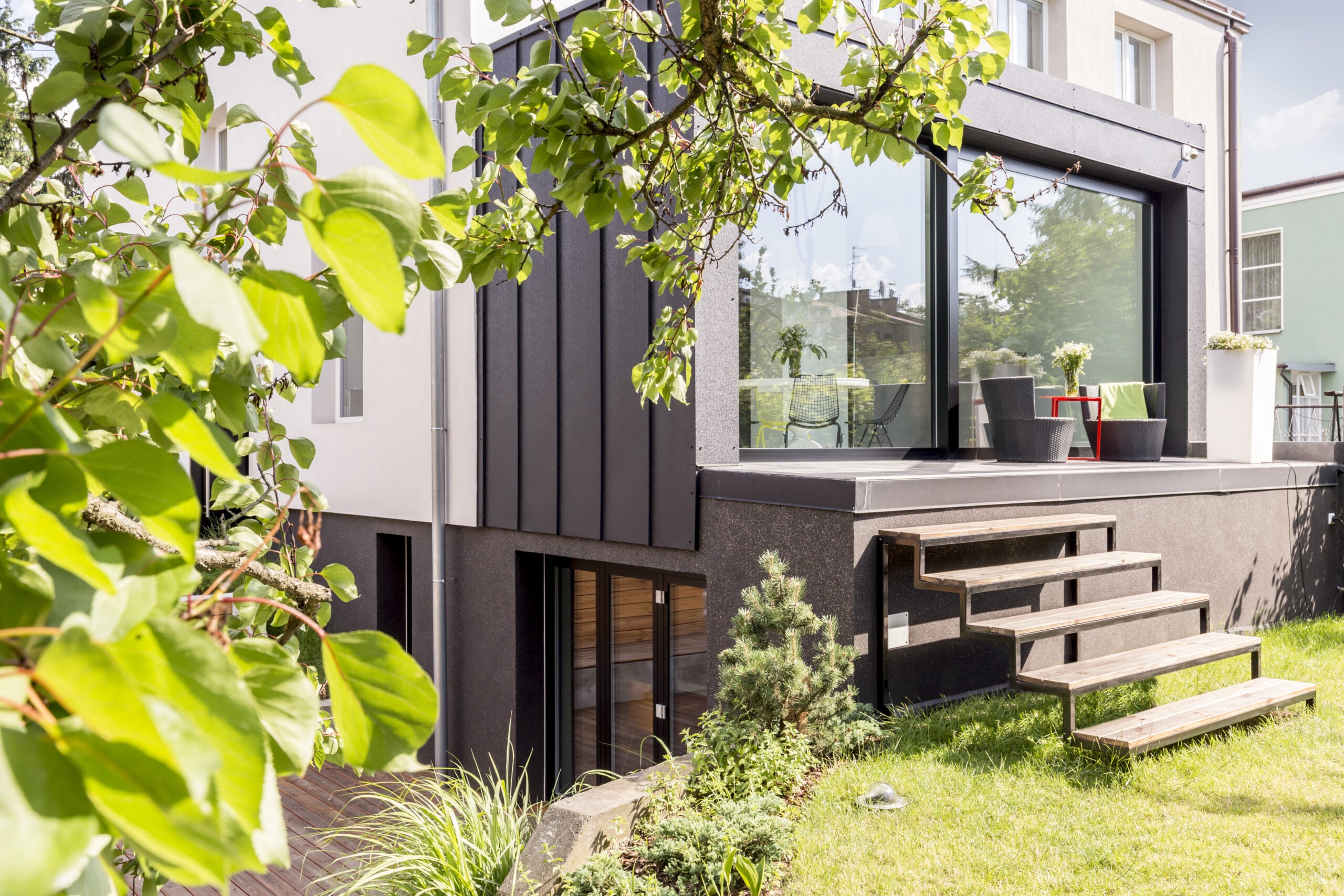 Modern home with lush garden terrace.