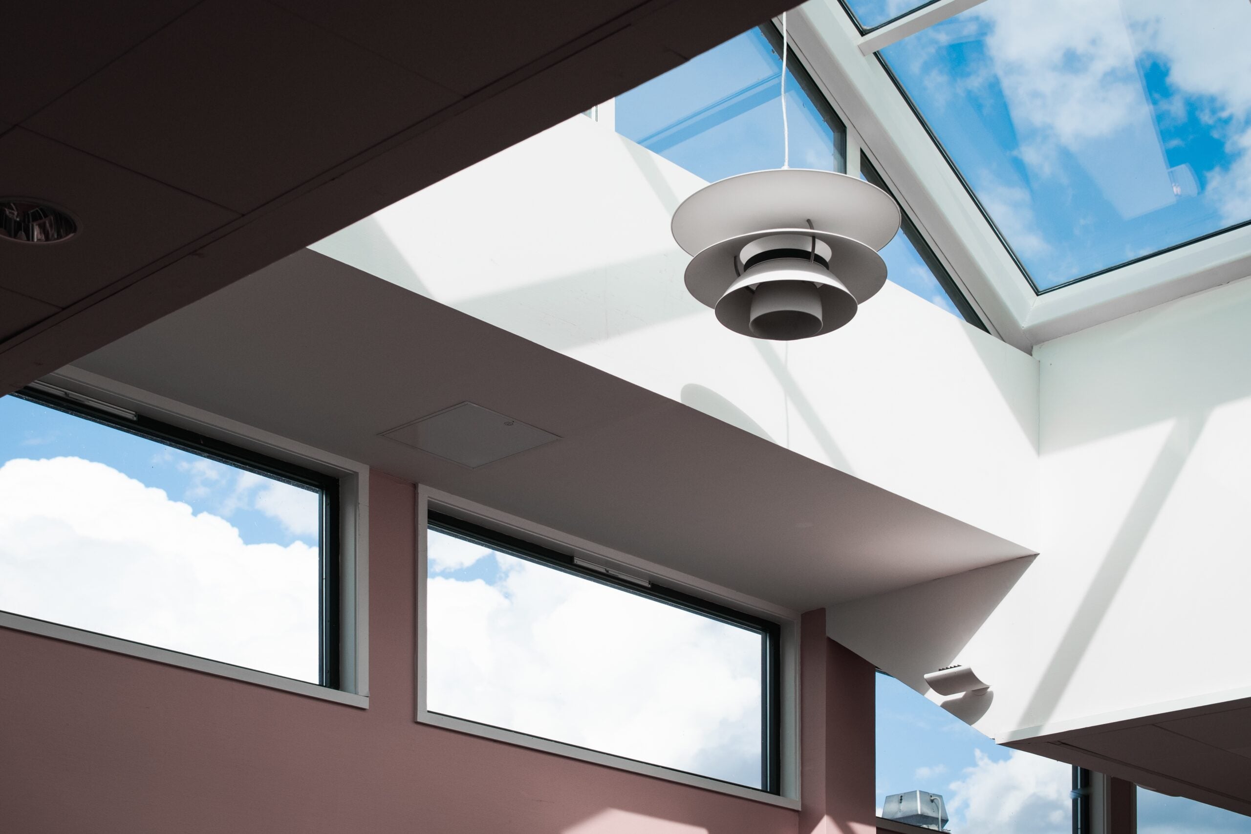 Modern lamp under a skylight ceiling.