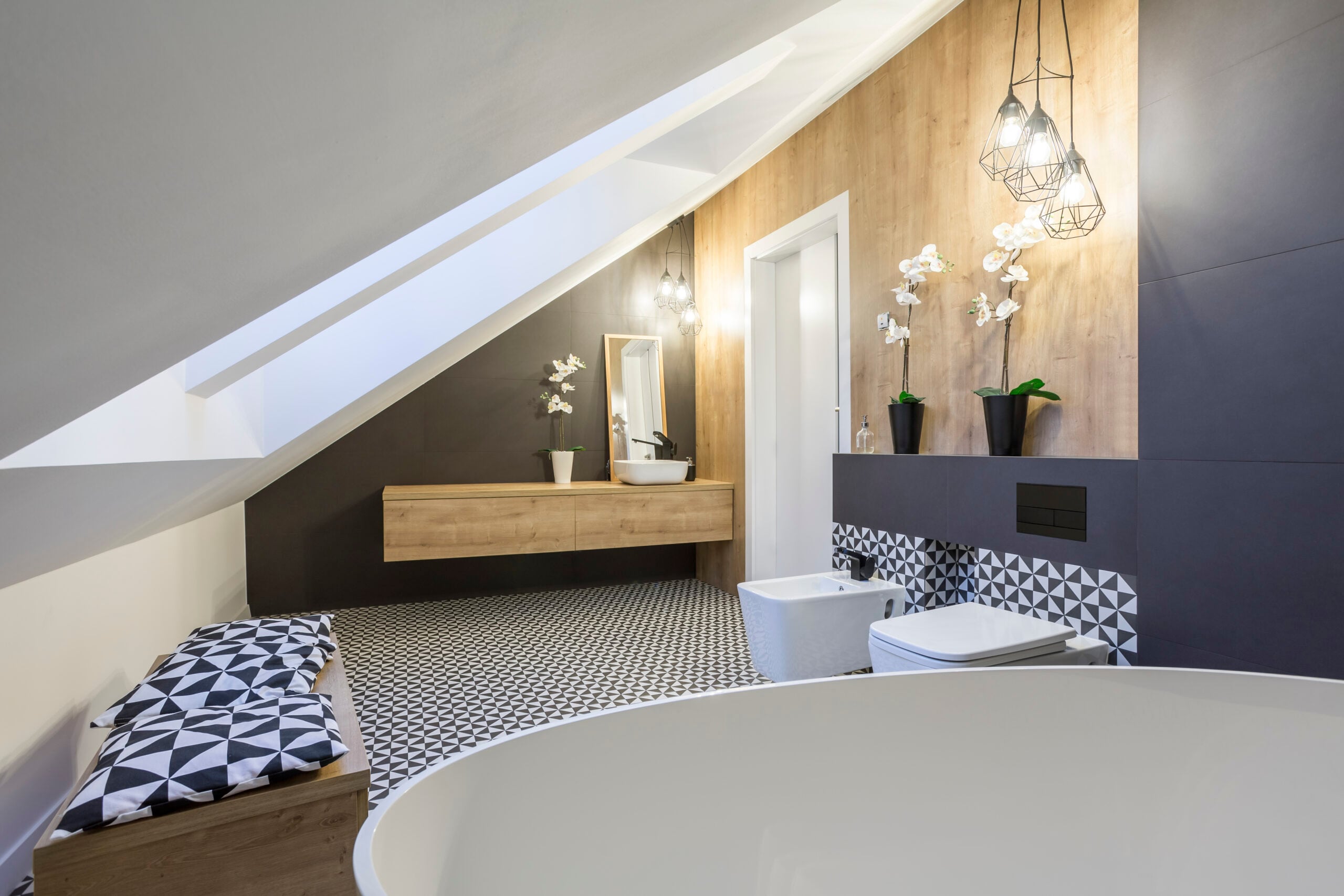 Modernly designed attic bathroom with rooflights